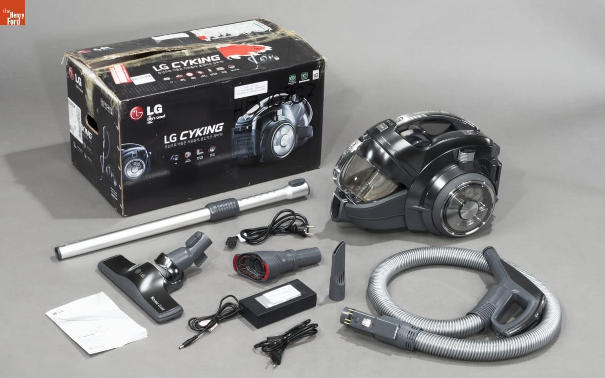 LG Electronics "CordZero C5" Cordless Canister Vacuum Cleaner, 2014-2015 Compact wheeled vacuum pictured with a box and many accessories
