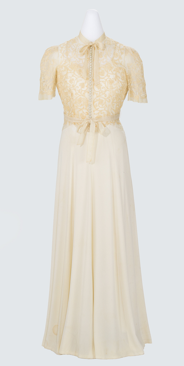 Evening Dress, Worn by Catherine Prindle Roddis, circa 1941 White or beige dress with short-sleeved lace top and long, slim skirt