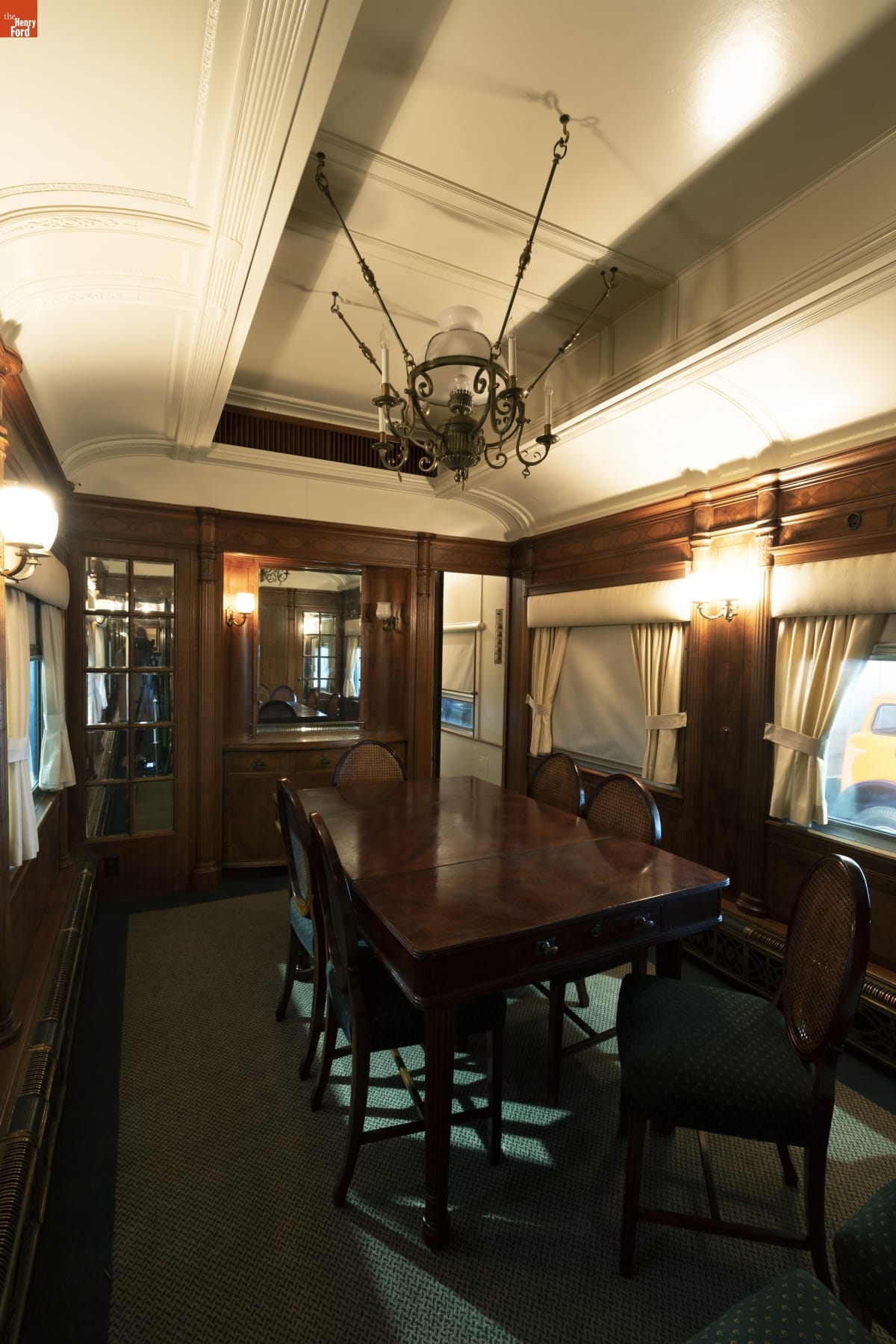 Henry Ford's Private Railroad Car "Fair Lane," 1921 Interior of railcar with wooden walls, table, and chairs