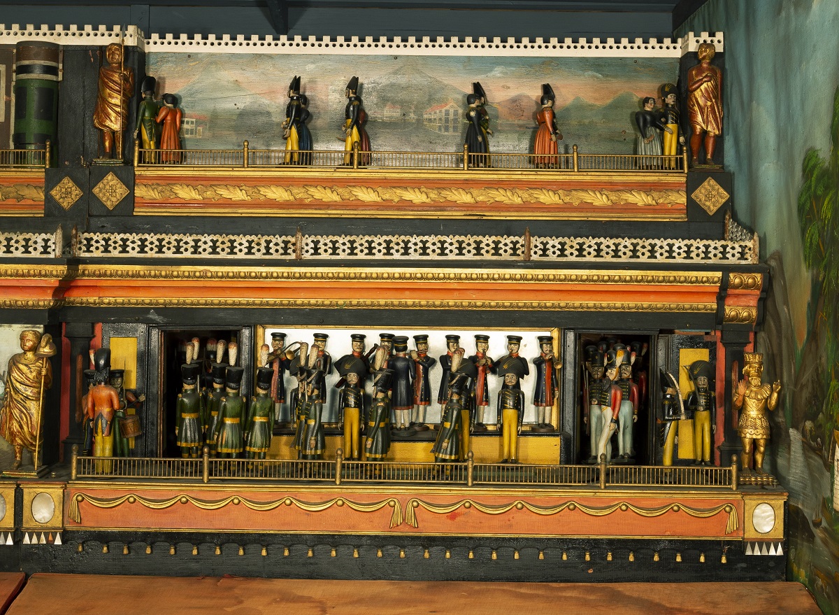"The Busy World" Automaton, 1830-1850 / detail Wooden platform with two carved scenes with human figures, one above the other