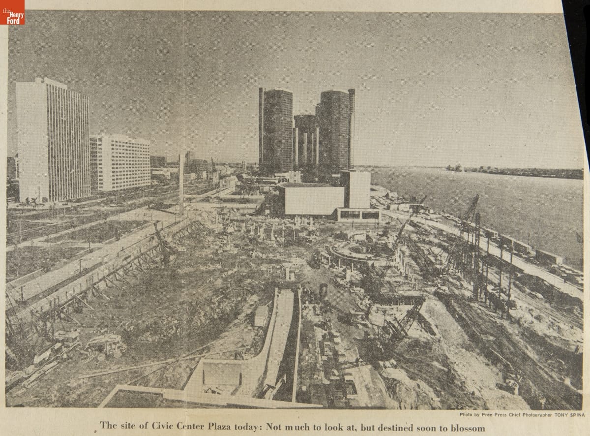 Detroit Free Press Article, "Park, Fountain To Rise at River," March 16, 1976 / photo 1 detail Image of construction site by river with tall buildings behind and to the side of it