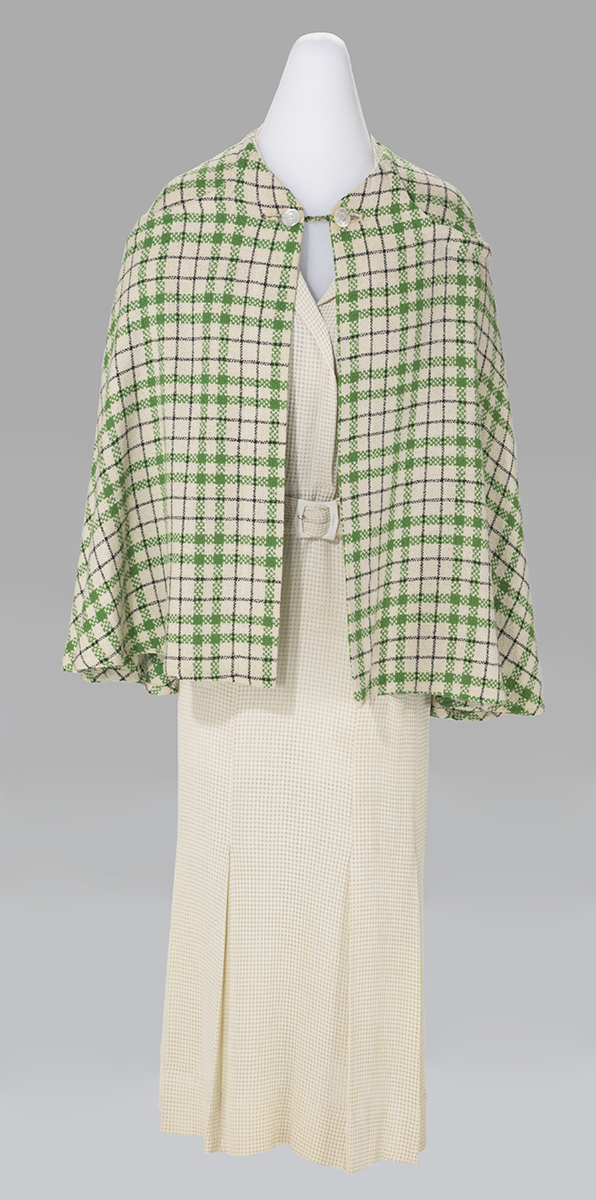 Dress, Worn by Catherine Prindle Roddis, 1940-1945 White dress with hip-length green-and-pink checked cape over it