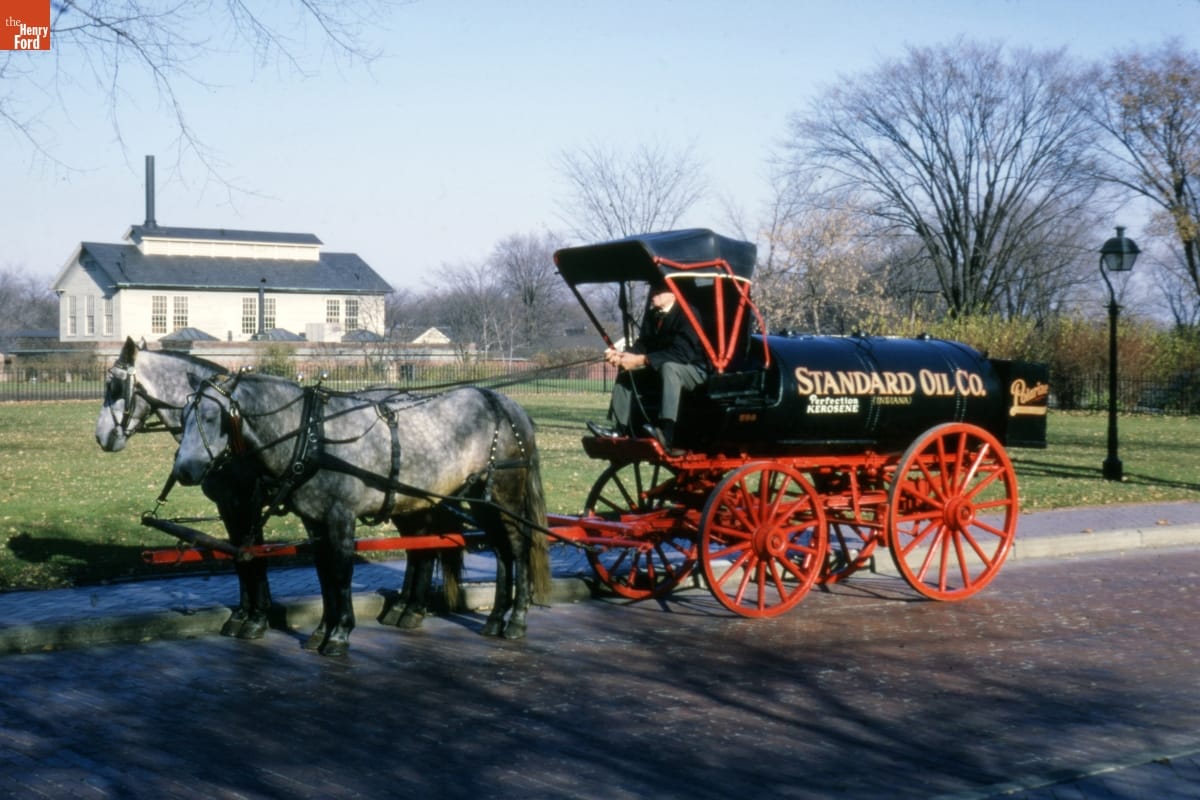 Oil Tank Wagon for Standard Oil Company, circa 1892 Two dappled horses hitched to a wagon with a black tank containing text for a body and four red wheels