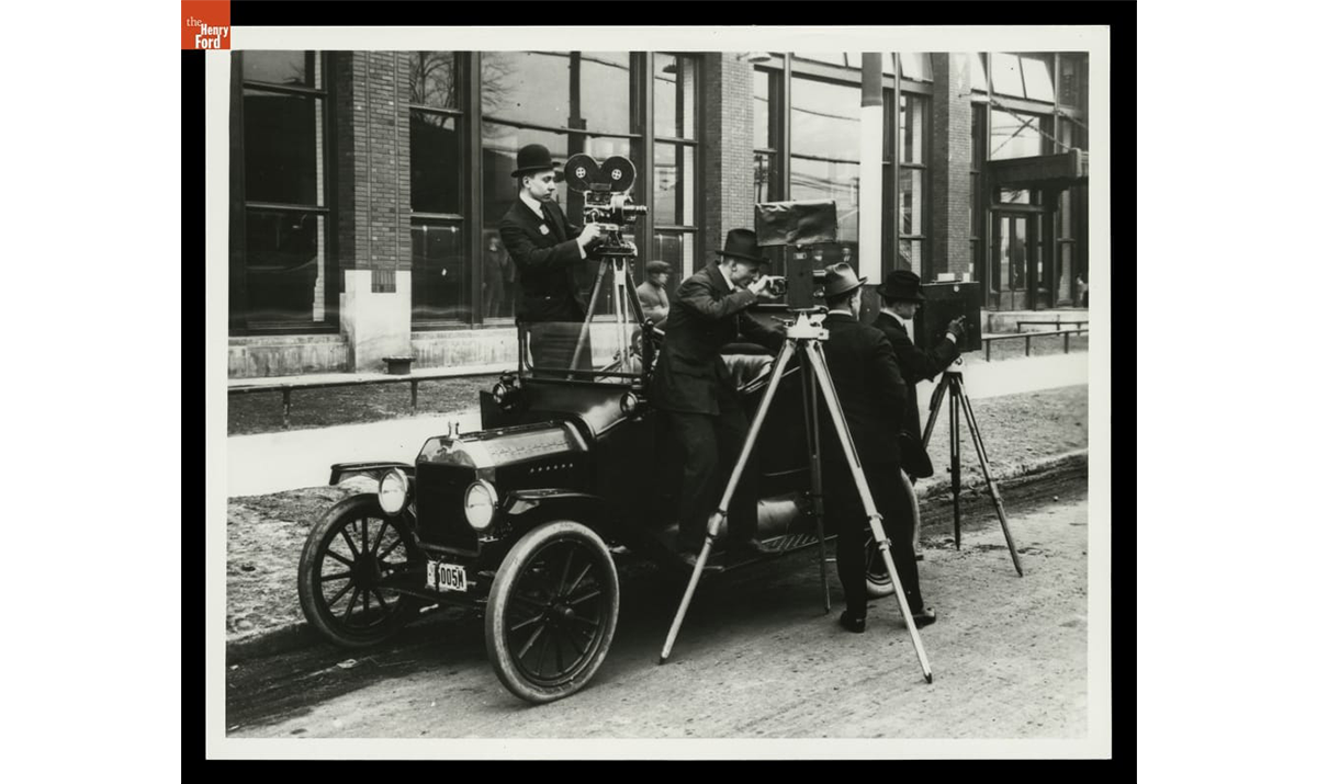 Ford Motor Company Photographers with Ford Model T Touring Car outside the Highland Park Plant. / THF119387