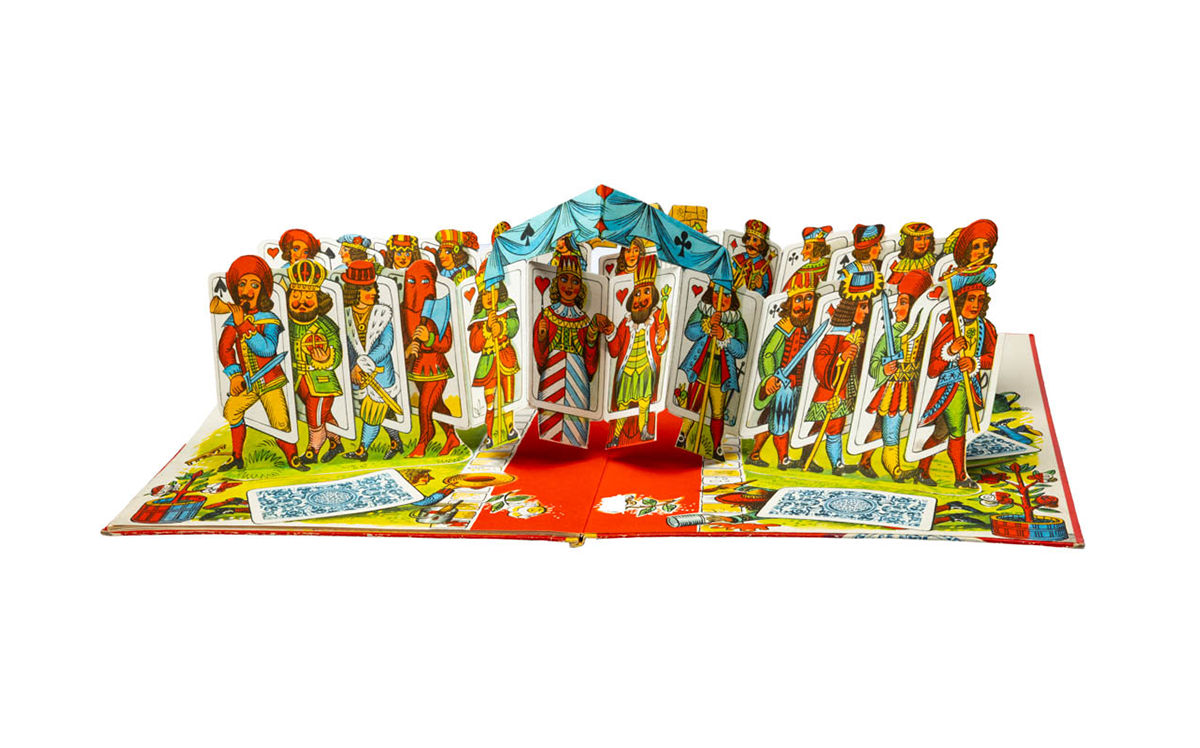 A host of card characters leap from the page at the end of the book.