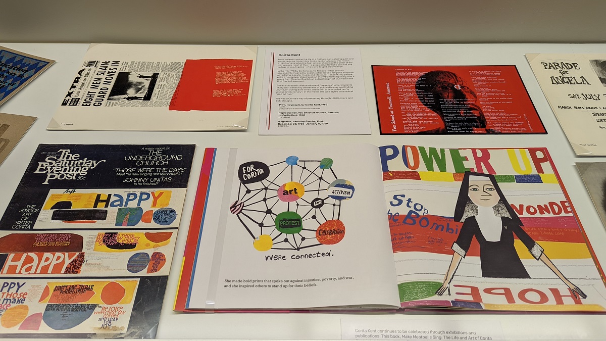 Several flat, colorful paper items--books, prints, and magazines