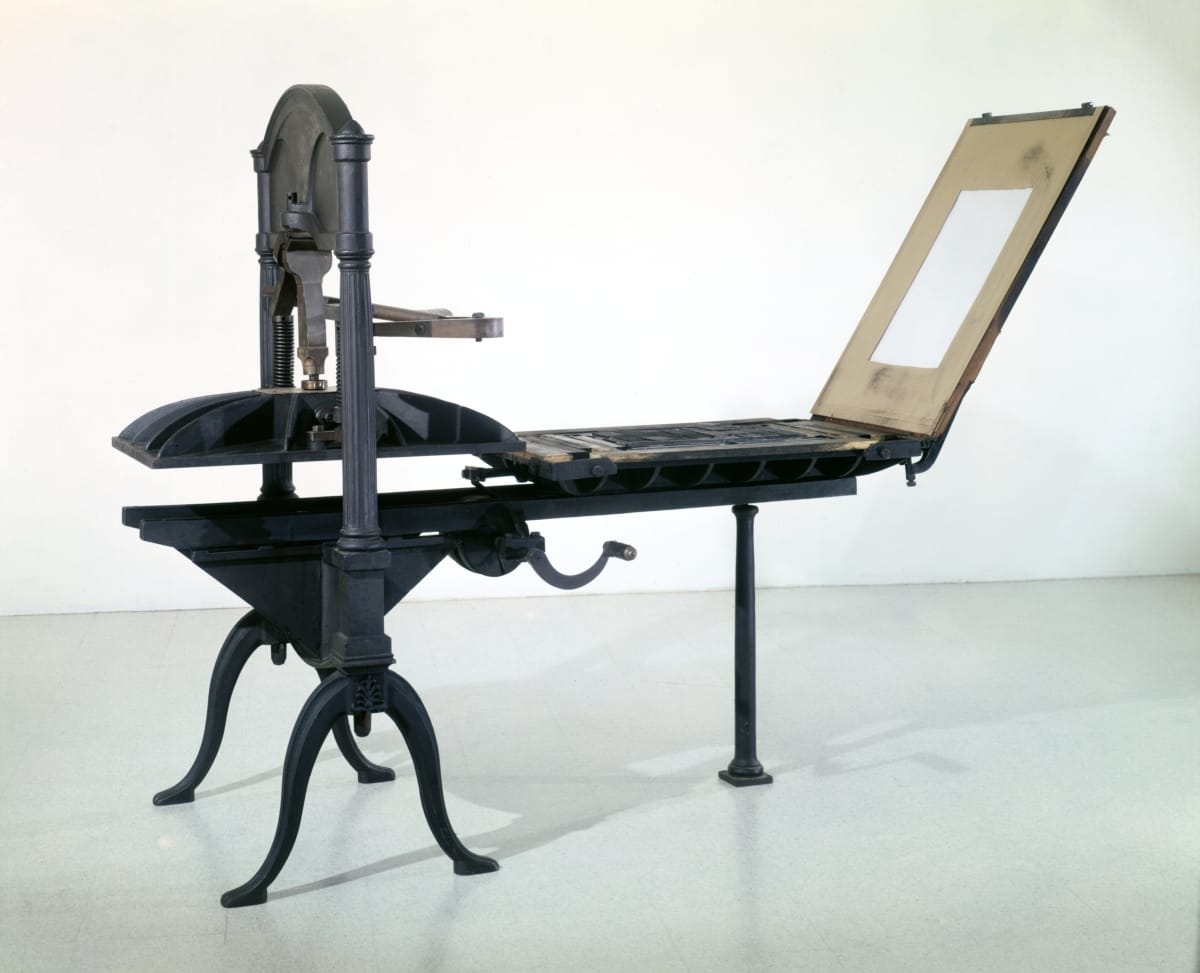 This modern photo shows the press with its tympan raised.