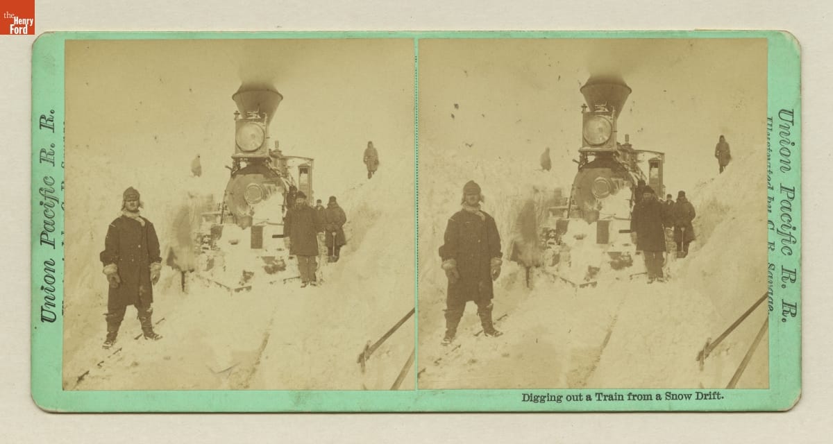 Union Pacific Railroad Stereograph View, Double image of a train on a track surrounded by snow with a number of people nearby