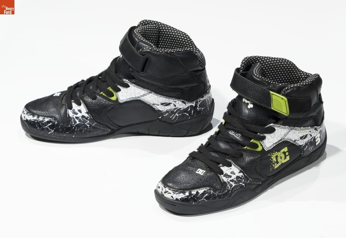 Driving Shoes Worn by Ken Block in Pair of black and white athletic shoes with yellow logo
