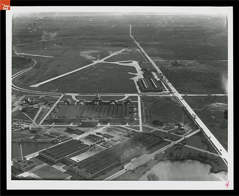 Aerial view showing the museum with its 12-acre roof, November 1931 / THF700318.
