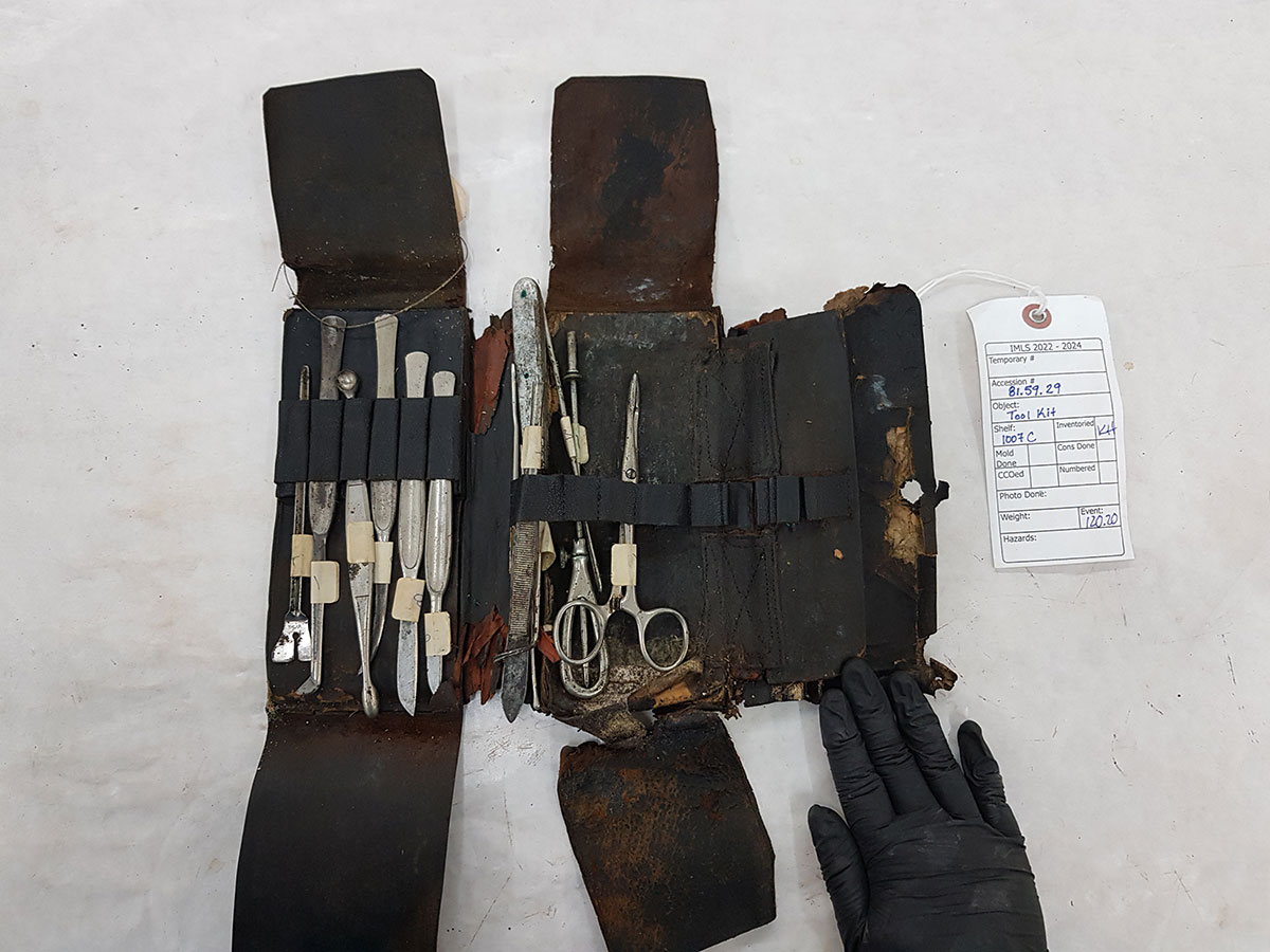 Veterinarian tool kit in need of restoration.